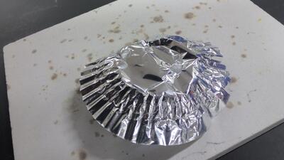 とけたアルミカップ